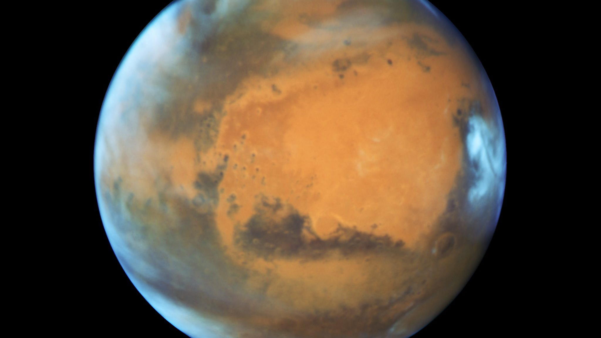 Asteroid 2018 VP1 kommt, dann dominiert der Mars den Himmel ARCHIV - 12.05.2016, USA, Maryland: HANDOUT - Der Planet Mars, aufgenommen vom «Hubble»-Weltraumteleskop. Mars ist dieser Tage besonders nah an der Erde und kann mit bloßem Auge am Nachthimmel beobachtet werden. Am 13.10.2020 wird die Erde genau zwis