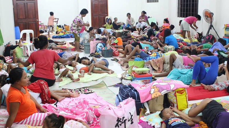 People are seen inside an evacuation centre in preparation for Typhoon Mangkhut in Cagayan, Philippines, in this September 13, 2018 photo by LGU Gonzaga Cagayan from social media. LGU Gonzaga Cagayan/Social Media/via REUTERS     ATTENTION EDITORS - T
