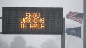 Snow Warning signs mark an entrance to the Kansas Turnpike near Lawrence, Kan., Sunday, Nov. 25, 2018. The turnpike section of I-70 remains open. I-70 is closed west of Junction City, Kan. (AP Photo/Orlin Wagner) |