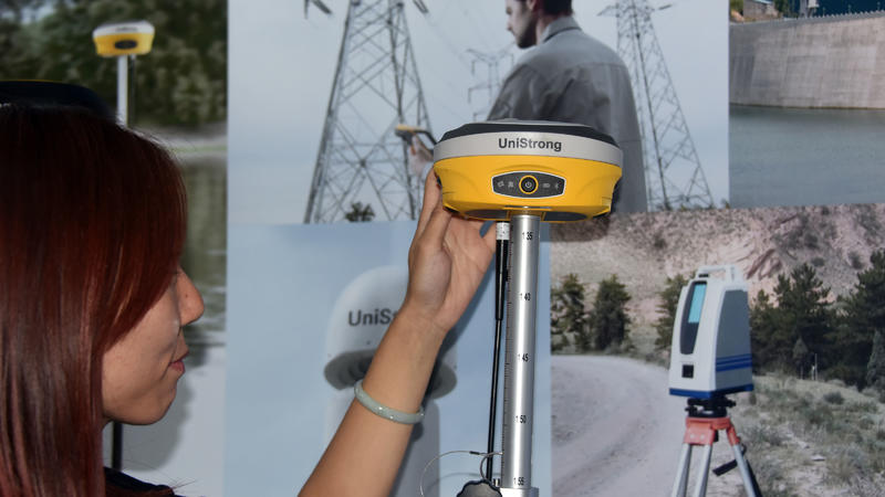 An employee displays a GNSS receiver during the 9th China satellite navigation technology and application exhibition in Harbin, northeast China's Heilongjiang Province, May 23, 2018. The ninth China Satellite Navigation Conference opened in Harbin, c