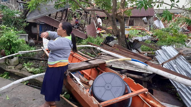A woman is seen near storm debris in Biliran, Philippines December 26, 2019. in this picture obtained from social media. VERMALYN MALOLOY-ON NAVARRETE via REUTERS THIS IMAGE HAS BEEN SUPPLIED BY A THIRD PARTY. MANDATORY CREDIT. NO RESALES. NO ARCHIVE