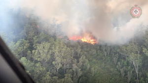 An aerial view shows bushfires on Fraser Island, Queensland, Australia, in this still image taken from video released on December 2, 2020. Queensland Fire and Emergency Services/via REUTERS THIS IMAGE HAS BEEN SUPPLIED BY A THIRD PARTY. MANDATORY CREDIT. NO RESALES. NO ARCHIVES.