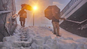  Two people descend a staircase from a snow-covered metro station after passing through the Filomena squall in Madrid Spain on 9 January 2021. The Filomena squall hits the capital hard, where bypasses and tunnels have been closed to traffic. The accumulations of snow will be 20 centimeters in the communities that are in red alert for this phenomenon. 09 JANUARY 2021 Jesus Hellin / LagenciaEP 01/09/2021 Madrid Madrid Spain Copyright: xJesusxHellinx 3509447
