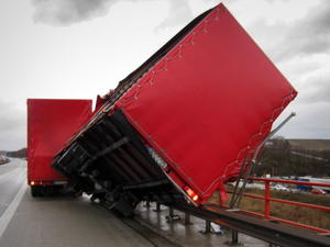 epa03035820 A handout handout provided by the Police of Rhineland-Palatinate shows a truck blown over by a gust of wind on the autobahn bridge on A61 near Alzey, Germany, on 16 December 2011. Due to heavy gusts of wind from storm front 'Joachim', the highway bridge on the A61 near Alzey was temporarily impassable, according to the Police. EPA/POLICE/RHINELAND-PALATINATE HANDOUT EDITORIAL USE ONLY/NO SALES  +++(c) dpa - Bildfunk+++