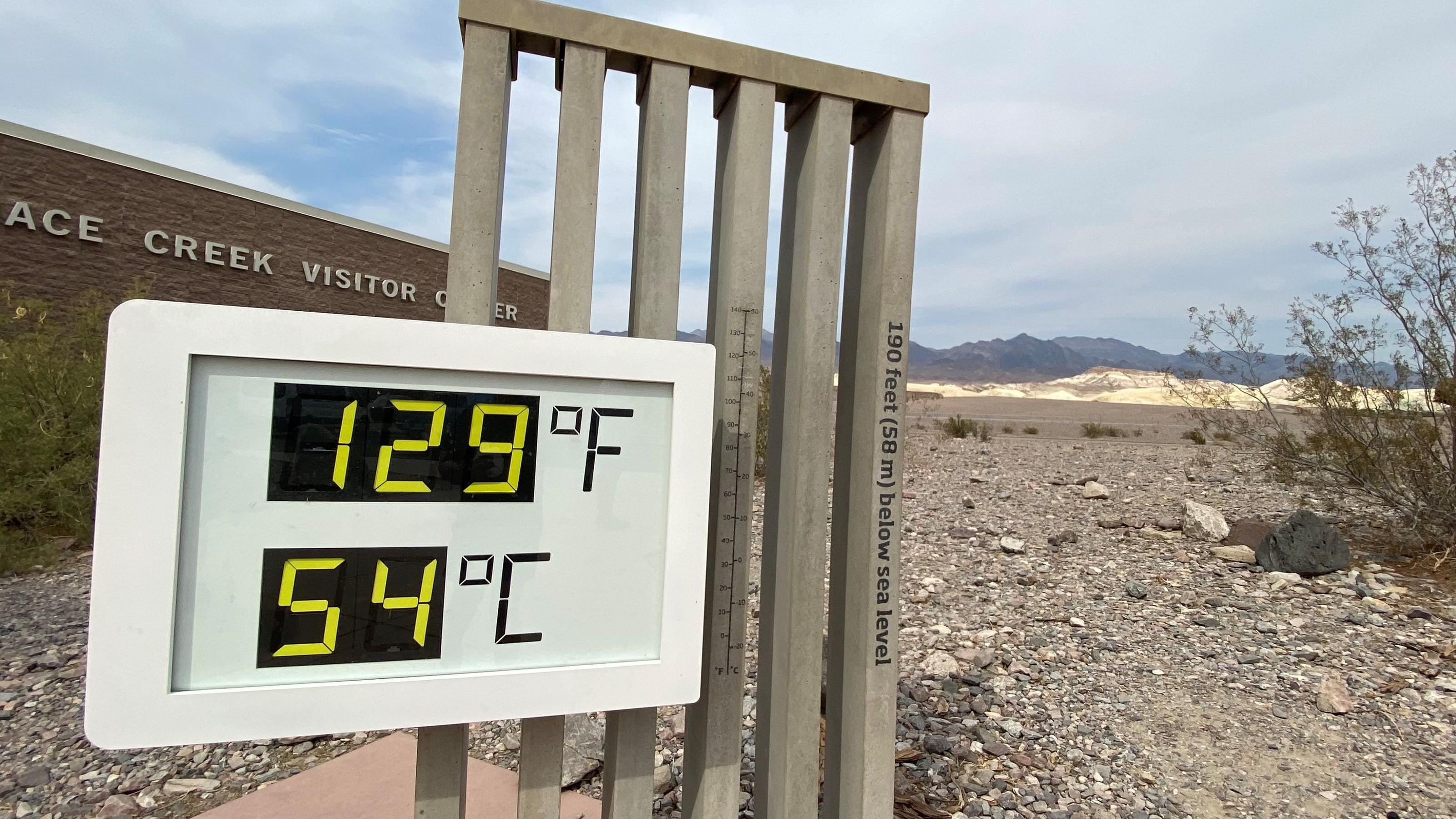 The thermometer at the Furnace Creek Visitor Center at Death Valley National Park shows temperatures reading 129 degrees Fahrenheit (53.8 C) in Death Valley, California, U.S. June 16, 2021. Picture taken June 16, 2021.  REUTERS/Norma Galeana