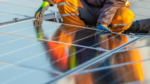 Solar panels installation on rooftop, ideal for any renewable article or wallpaper