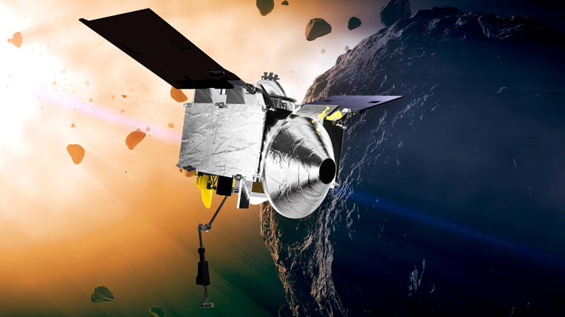 FILE - This illustration provided by NASA depicts the OSIRIS-REx spacecraft at the asteroid Bennu. On Wednesday, Aug. 11, 2021, scientists said they have a better handle on asteroid Bennuâ€™s whereabouts for the next 200 years. The bad news is that t
