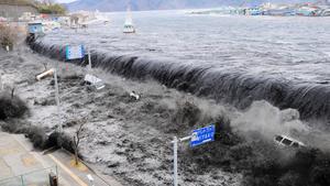 FILE - A picture released 15 March 2011 shows waves overwhelm a levee, swallowing a seaside village near the mouth of Hei River, Japan, 11 March 2011 after a tsunami and an earthquake hit Japan 11 March 2011. A Japanese paper reporst Friday, March 18 2011, that the tsunami wave, which hit the country March 11, was up to 23 meters high.  EPA/Mainichi Newspaper JAPAN OUT EDITORIAL USE ONLY/NO SALES EPA/AFLO/Mainichi Newspaper JAPAN OUT EDITORIAL USE ONLY/NO SALES EDITORIAL USE ONLY/NO SALES  +++(c) dpa - Bildfunk+++