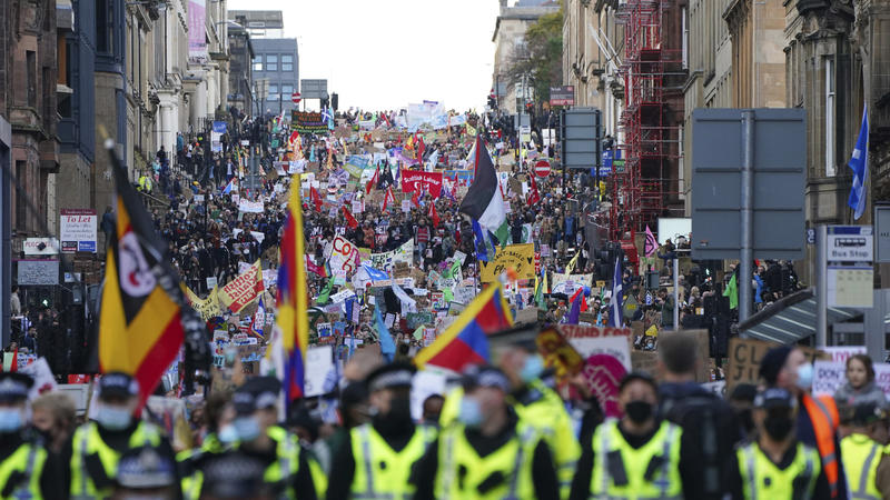 Climate activists march through the streets of Glasgow, Scotland, Friday, Nov. 5, 2021 which is the host city of the COP26 U.N. Climate Summit. The protest was taking place as leaders and activists from around the world were gathering in Scotland's b