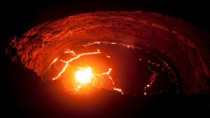 View from the crater rim of Erta Ale - one of the most active vulancoes in the world - into the active, red glowing lava lake.