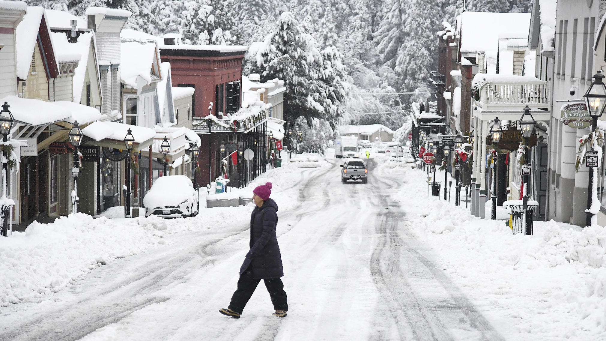 While snowfall was picturesque in places such as along Broad Street in Nevada City, Calif., it was dangerous for many others who were without electricity or stuck in the snow. (Elias Funez/The Union via AP)