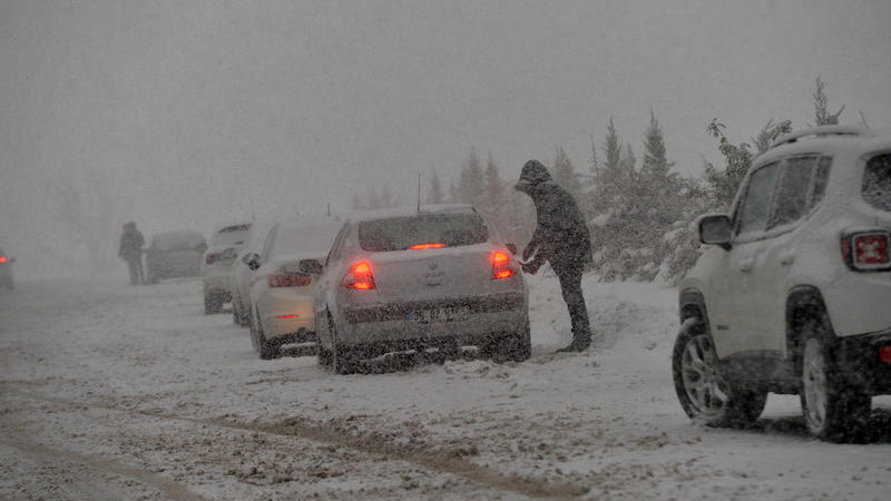 People drive in snowy weather in Ankara, Turkey
