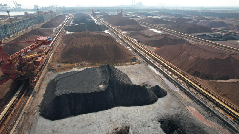SUZHOU, CHINA - FEBRUARY 21, 2022 - An aerial photo taken on February 21, 2022 shows a ship unloader unloading imported iron ore at wugang Wharf in Taicang, Suzhou city, Jiangsu Province, China.