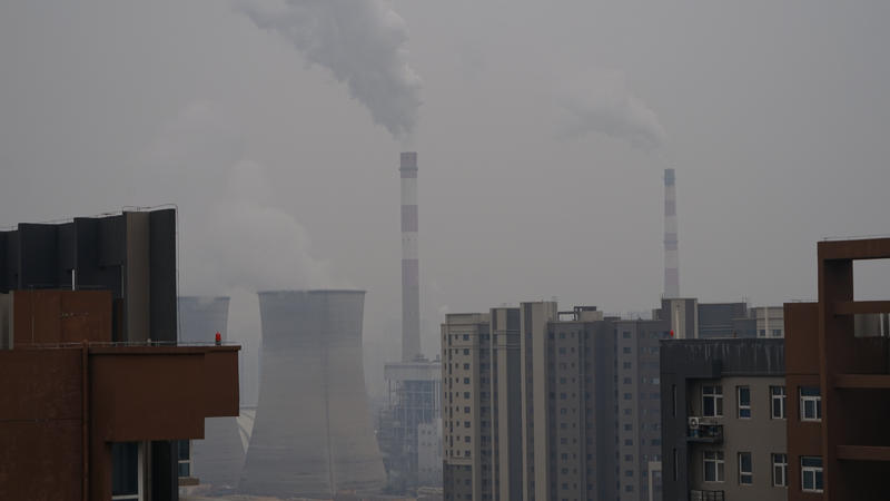 A view of a coal-fired power plant and buildings in Xi 'an, Shaanxi Province, China.