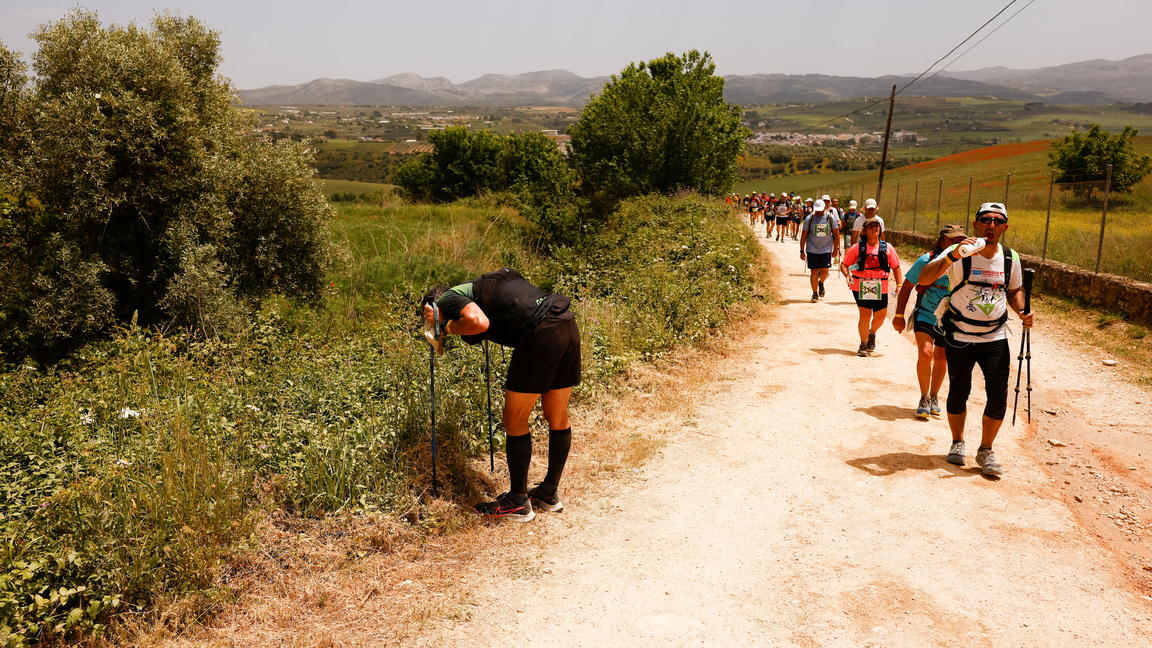 A runner takes a break as he participates in the running category during the XXIII 101km international competition
