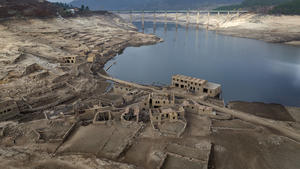 FILE - Parts of the old village of Aceredo, submerged three decades ago when a hydropower dam flooded the valley, which reemerged due to drought at the Lindoso reservoir, in northwestern Spain, Saturday, Feb. 12, 2022. Spain is breathing a sigh of relief as a sharp drop in temperatures is helping firefighters contain wildfires across the country that destroyed tens of thousands of acres of wooded land. (AP Photo/Emilio Morenatti, File)