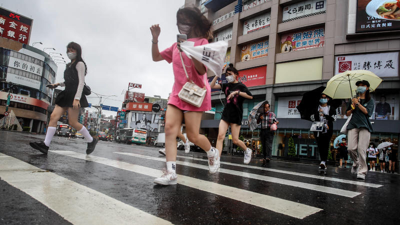  September 2, 2022, New Taipei, New Taipei, Taiwan: People rush through a zebra crossing under heavy rain with strong wind, as Typhoon Hinnamnor approaches closer to the waters of Taiwan, bringing heavy and extremely rain to mountainous areas across 