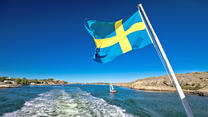 Swedish flag on the boat in Gothenburg islands archipelago, Vastra Gotaland County, Sweden