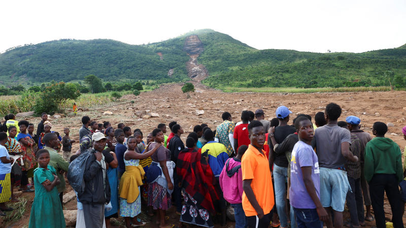 Locals of Mtauchira village looks at the path of the mudslide where many people lost their lives in the aftermath of Cyclone Freddy in Blantyre, Malawi, March 16, 2023. REUTERS/Esa Alexander