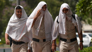 NEW DELHI, INDIA - MAY 29: Police personnel cover their face with a cloth to save themselves from the ongoing heatwave, on a hot summer day in New Delhi, India on May 29, 2024.Â The national capital records a scorching high of 49.9 degrees Celsius amid a heatwave alert until May 30. Rajasthan, Punjab, Haryana, Western UP, and Madhya Pradesh are also on red alert. Amarjeet Kumar Singh / Anadolu