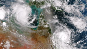 epa04628269 A handout photograph made available by the US National Oceanic and Atmospheric Administration (NOAA) showing Typhoon Lam in the Arafura Sea and Typhoon Marcia off the east coast of Queensland are both expected to make landfall on 19 February 2015. Both storms are over waters conducive for steady strengthening up until landfall. This image is a combination of two passes from the Suomi NPP satellite's VIIRS instrument taken around 0345Z to the east and 0530Z to the west on 19 February 2015. EPA/NOAA / HANDOUT HANDOUT EDITORIAL USE ONLY/NO SALES +++(c) dpa - Bildfunk+++