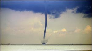 A waterspout above the Wadden Sea in northern Netherlands, 09 July 2007. A waterspout is a whirlwind, caused by heavy air turbulence, that sucks up water when it arrives above sea. EPA/Meijert de Haan +++(c) dpa - Bildfunk+++