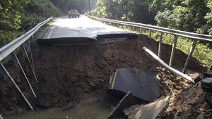 The West Virginia State Highway 4 along the Elk River shows extensive damage after flood water has dropped in the Clendenin, West Virginia, U.S., June 25, 2016. hit by flooding.   Courtesy West Virginia Department of Transportation/Handout via REUTERS   ATTENTION EDITORS - THIS IMAGE WAS PROVIDED BY A THIRD PARTY. EDITORIAL USE ONLY  TPX IMAGES OF THE DAY