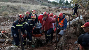 ATTENTION EDITORS - VISUALS COVERAGE OF SCENES OF DEATH AND INJURY: Members of a search and rescue team carry the body of a victim, following flash floods which hit areas west of Athens on November 15 killing at least 20 people, in Mandra, Greece, November 19, 2017. REUTERS/Costas Baltas